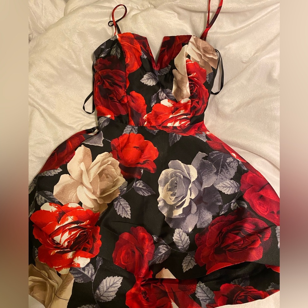 Black dress with red and white roses! Size 5 it’s stunning with a cute bow